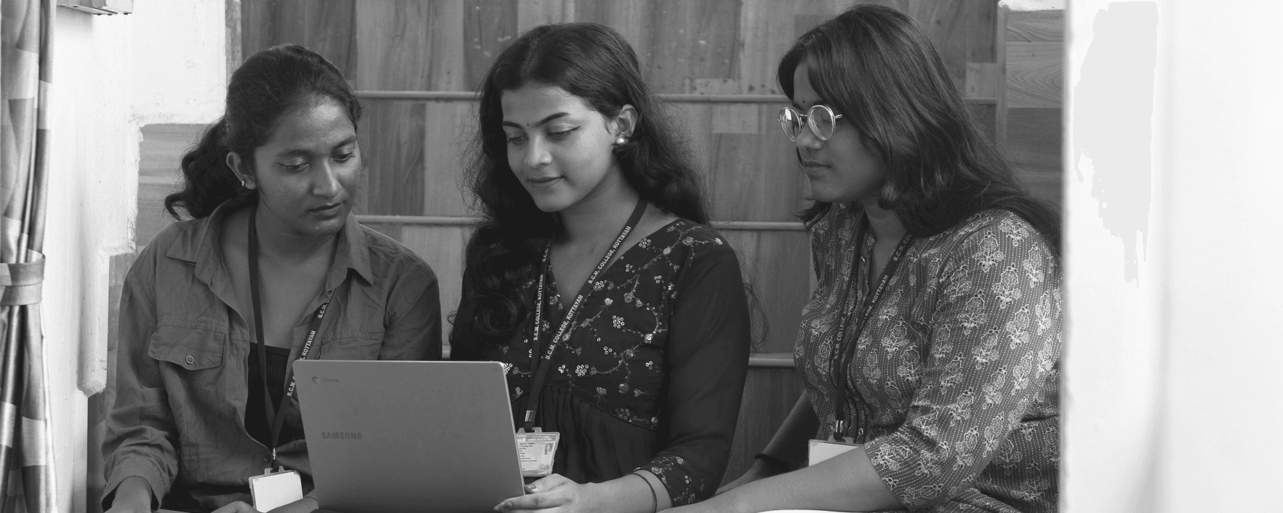 Students using laptop in library